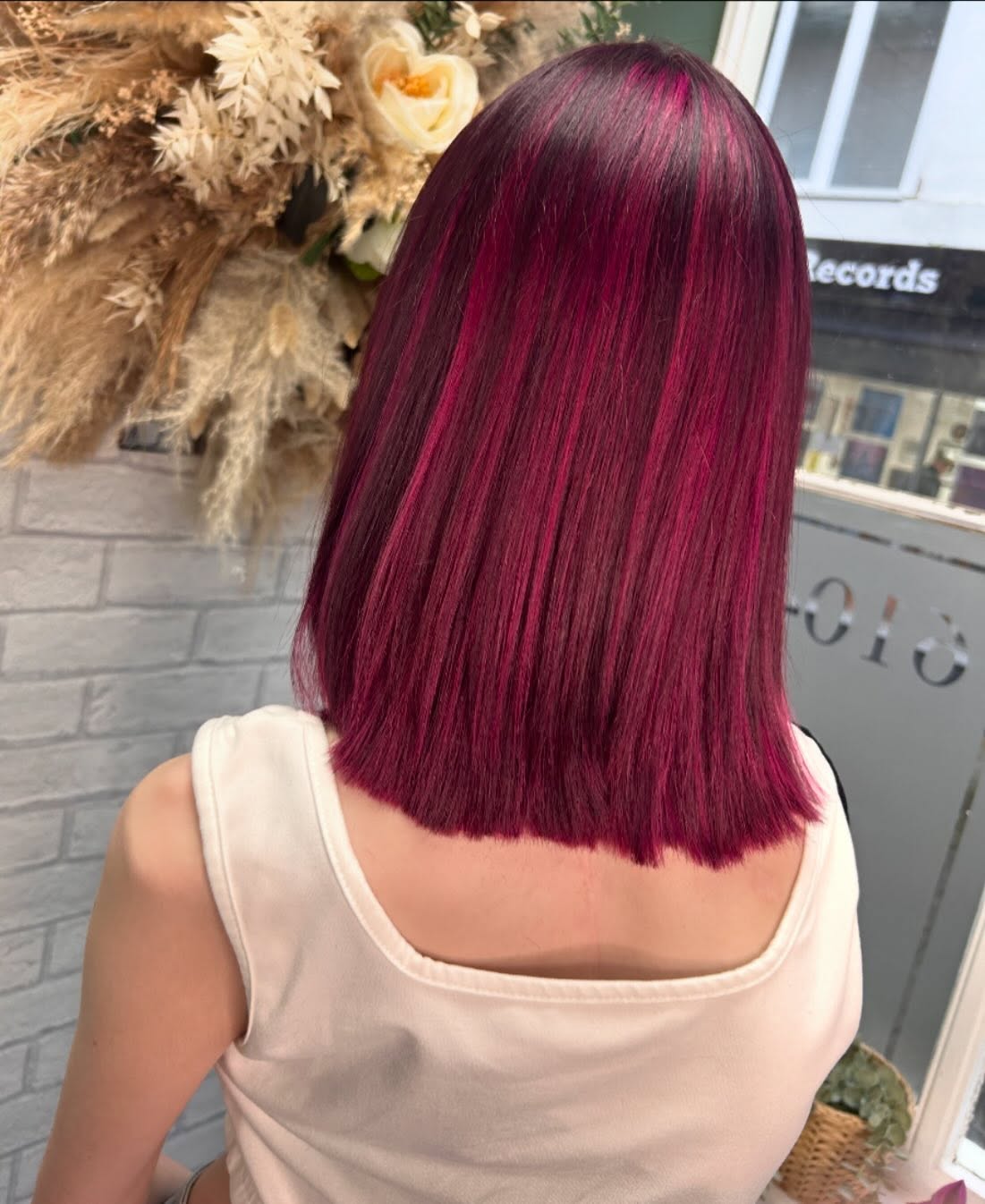 A vivid magenta bob